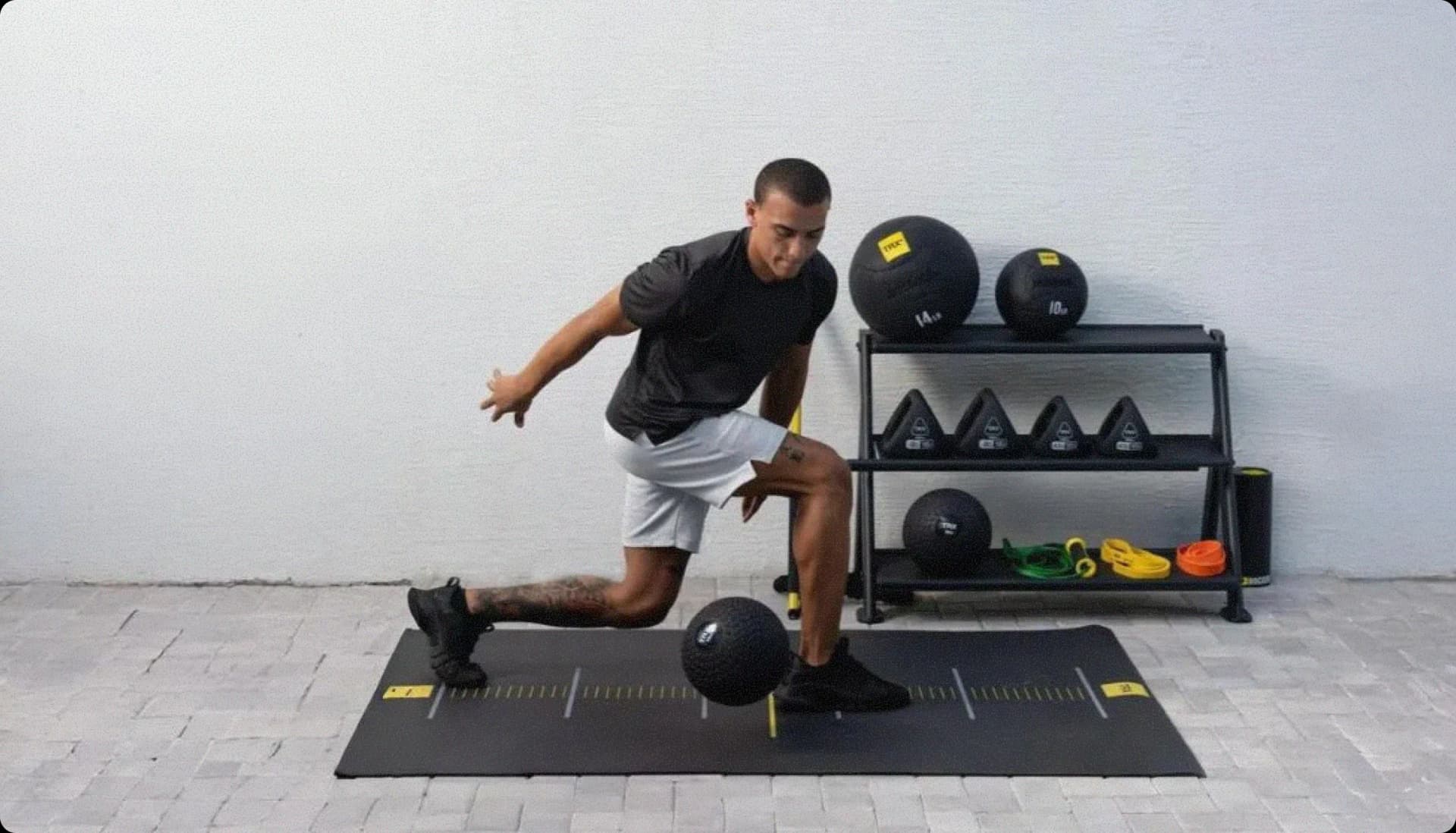 Athlete training with TRX fitness equipment