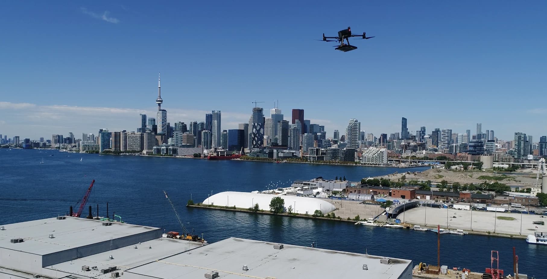Hover drone in flight over San Francisco Bay with the Bay Bridge and downtown skyline