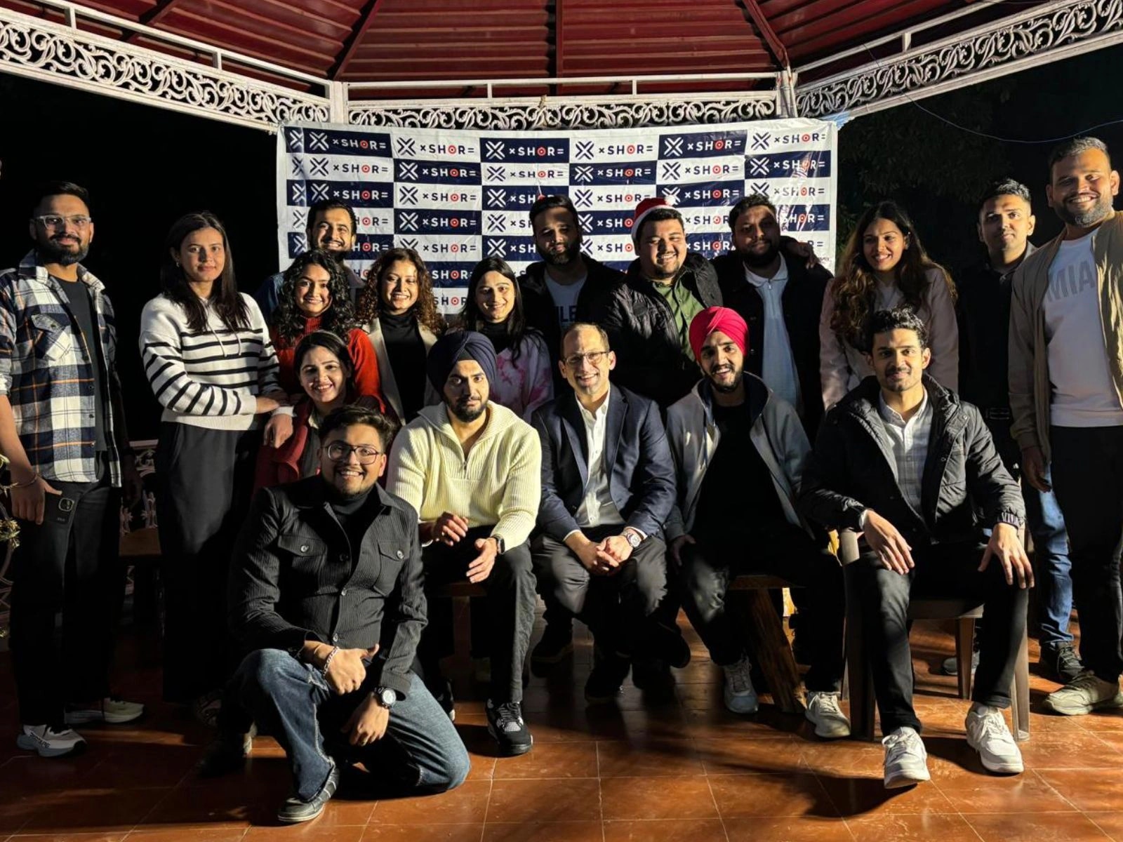 The Klyvora team gathered for a group photo at an evening event in India